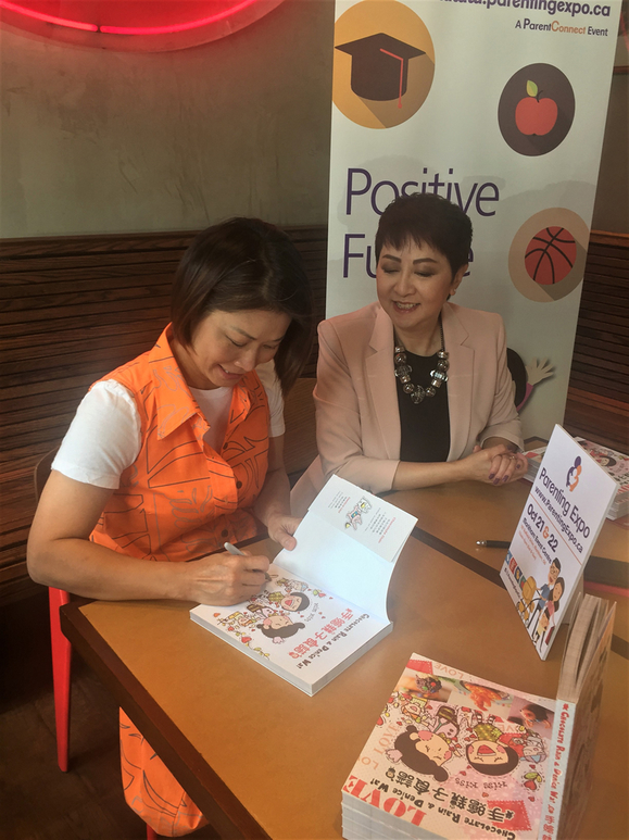 Denice signing her book (1).jpg
